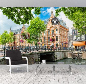 Picture of Typical canal side cityscape of Amsterdam opposite from the 17th century HQ of the Dutch East India Company now used by the University of Amsterdam